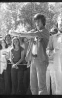 Cow-milking contest in the UU Plaza, February 23, 1978