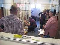 Chuck reviews the vintage 33 rpm vinyl record albums stored in the lobby
